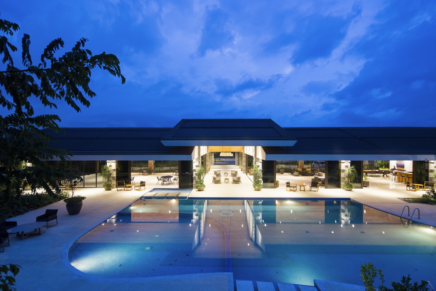 Hospitality property with coordinated architectural and pool lighting